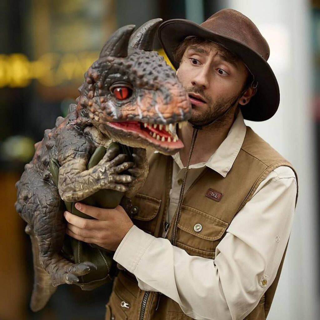 Ranger holding a baby Dinosaur.