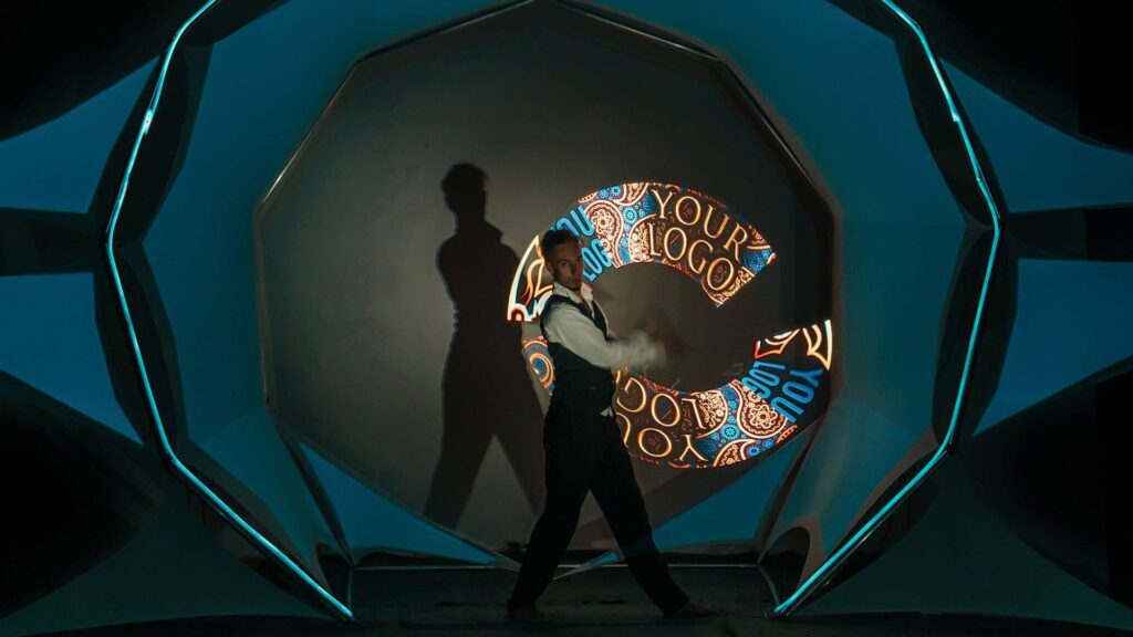 Branded video mapping dance performer waving LED screen showing where branding can be placed.