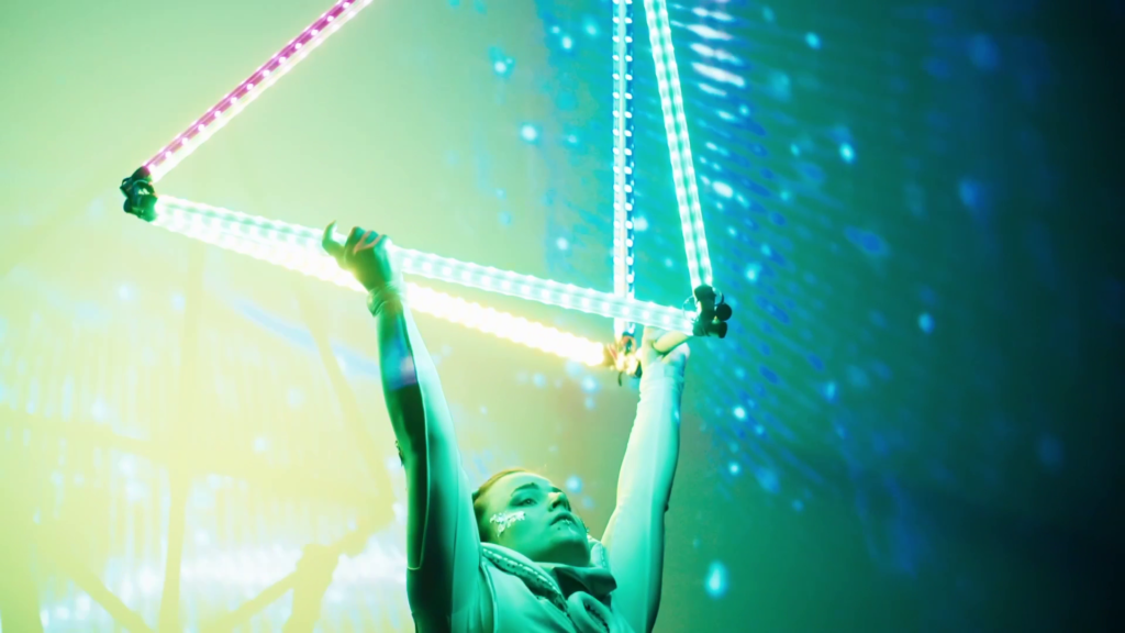 Acrobat performing with LED lights.