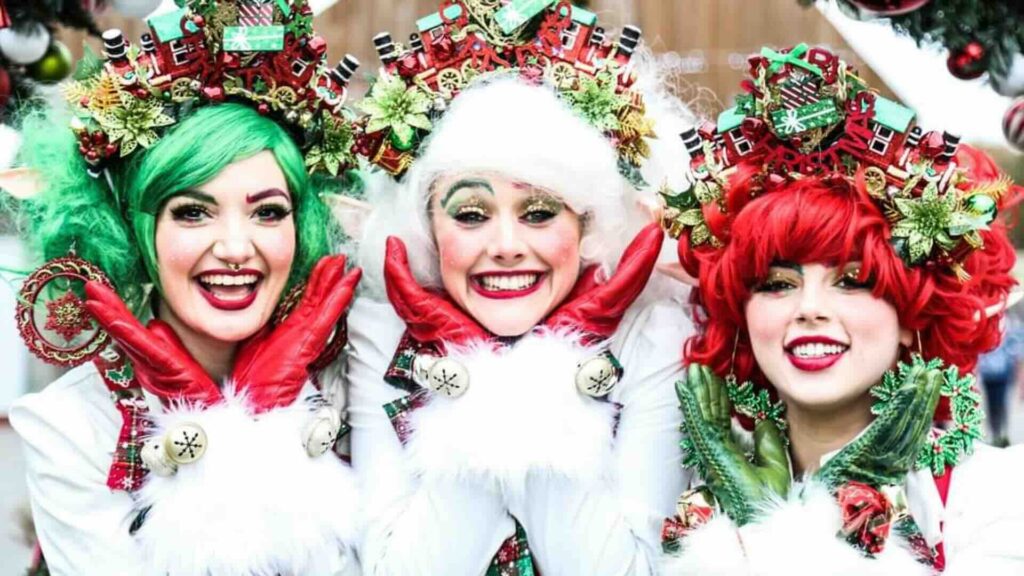 Festive Elves posing for a photo together