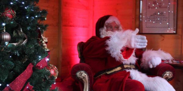 Santa greeting children as they come visit!
