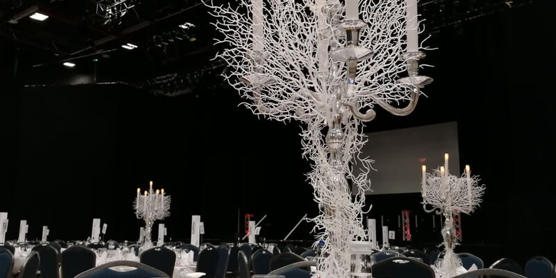 White Candleabra table centrepiece available for Winter Wonderland Themed Events.