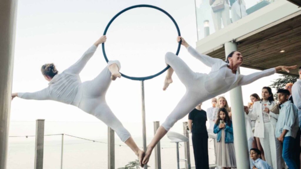 Aerial Performers suspended from a hoop.