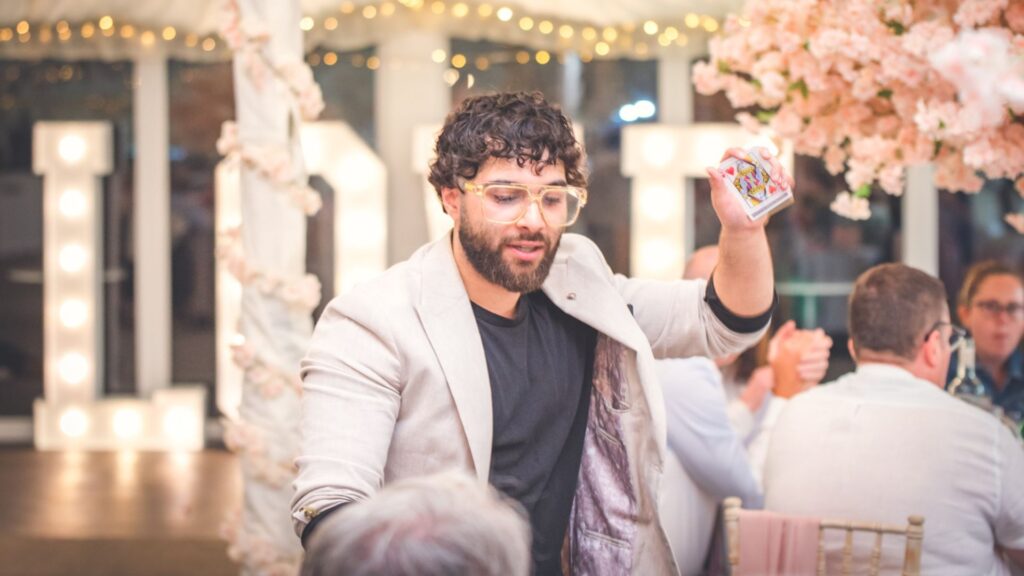A Magician showing off his skills at a Gala Dinner event