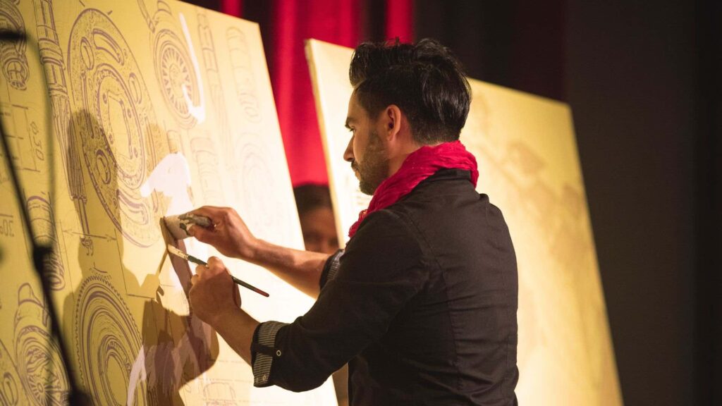 Live Painter working on a large piece at a Gala Dinner