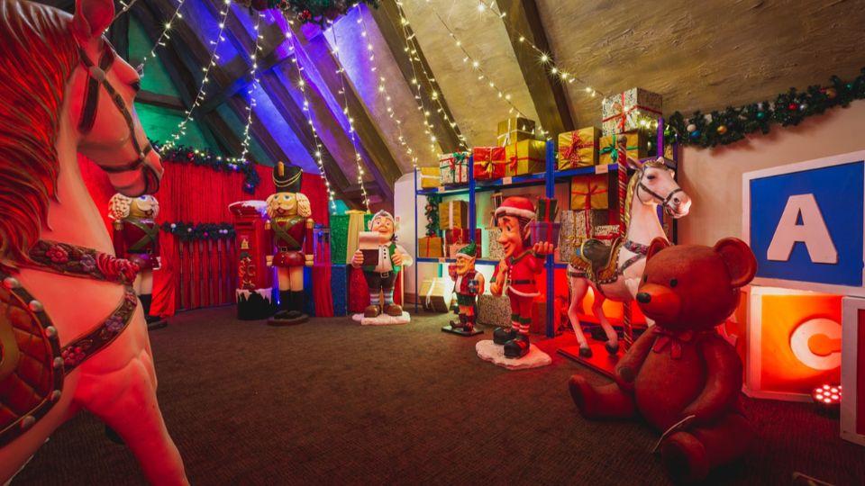 Christmas toyland theme grotto design with nutcrackers, giant toys and elves.