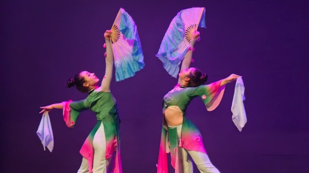 Chinese Dancers on-stage with traditional attire
