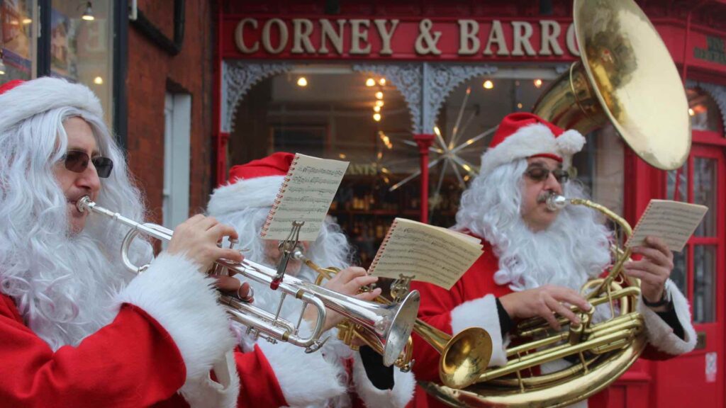 Hire traditional Christmas brass band in Santa outfits for Christmas events across the UK.