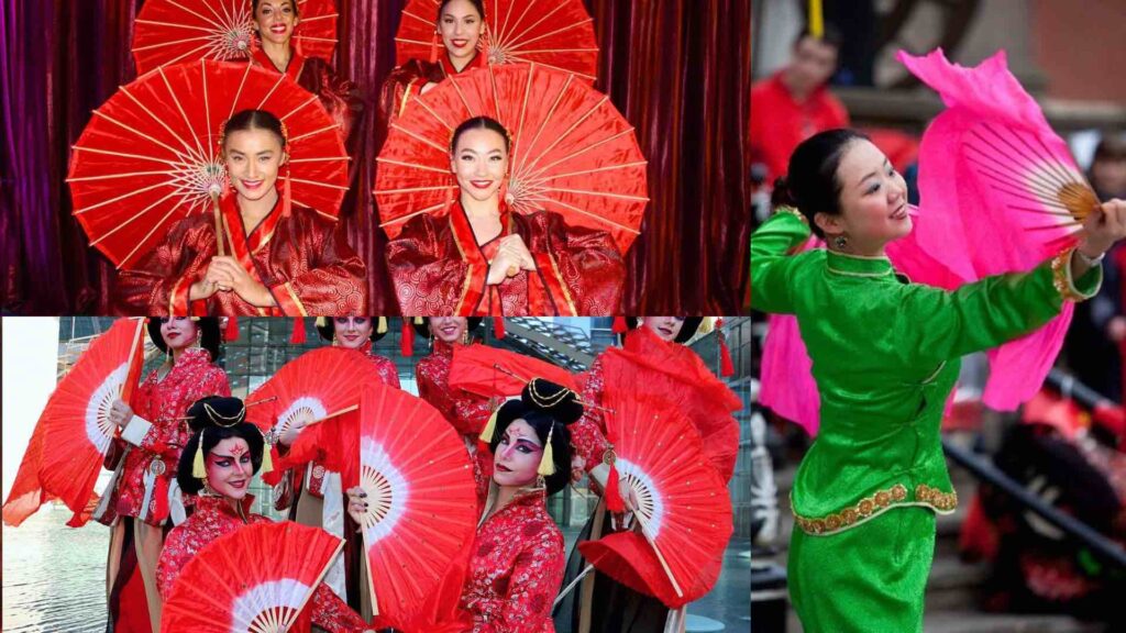 Lunar New Year traditional dancers in costume with fan props.