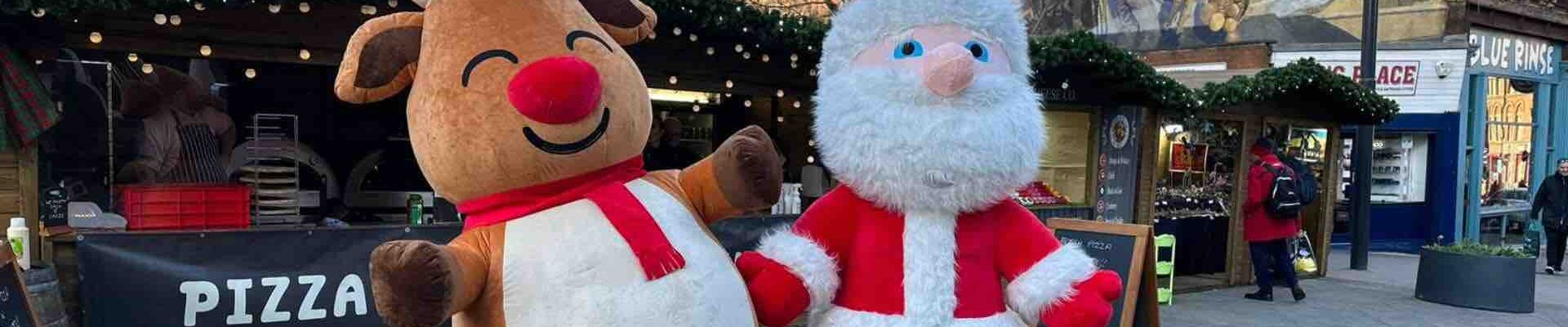 Reindeer and Santa walkabout Mascots Reindeer and Santa walkabout Mascots