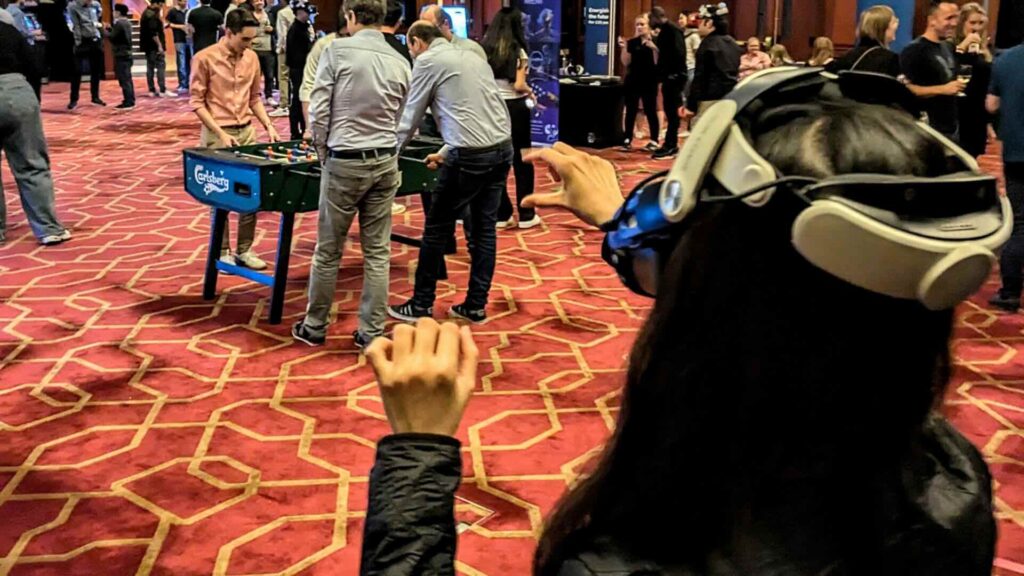 Conference attendees engaging in team building Metaverse experience.