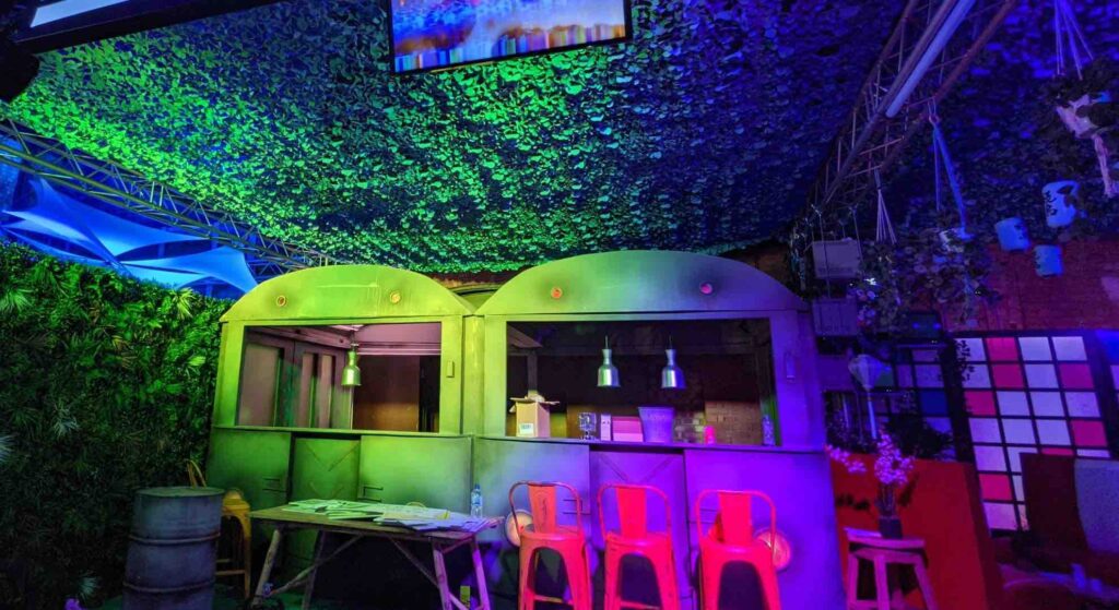 A futuristic and dystopic catering area at the Sidemen event we created with metal looking food stands and stands.