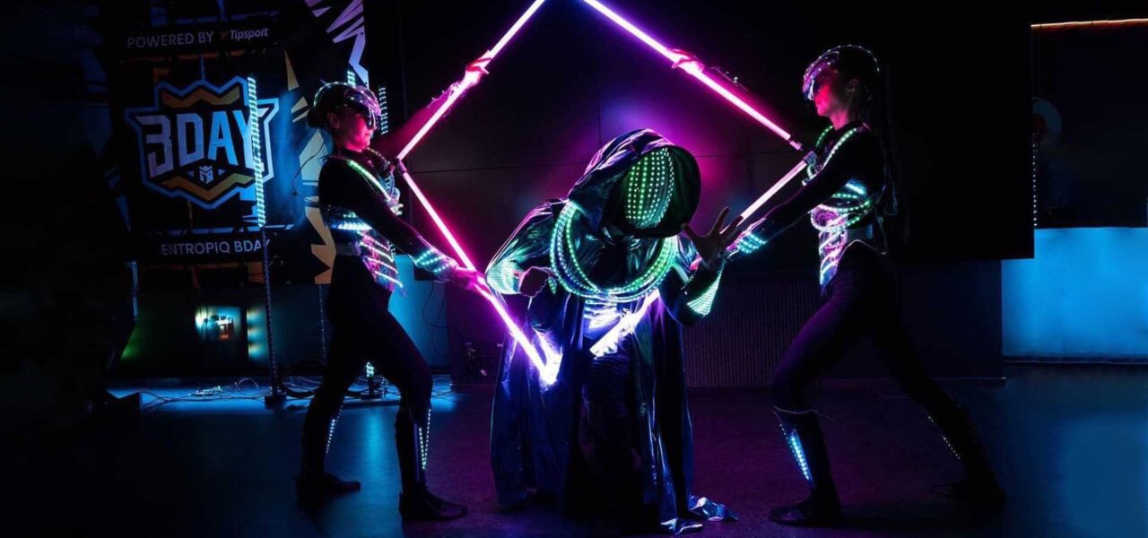 Futuristic performers entertaining guests at a sci-fi themed event.