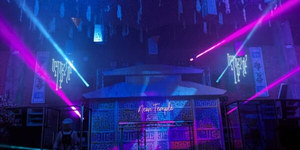 The neone temple illuminated in futuristic pinks and blues as part of a futuristic themed event.