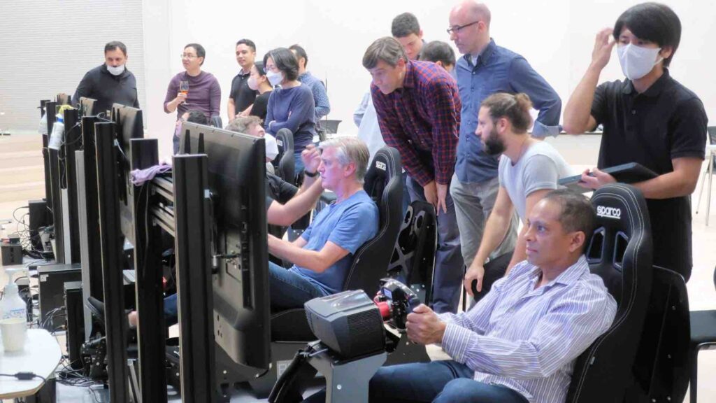 Guests using Racing Simulators at a corporate event.