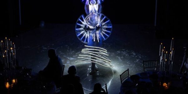 Sci fi themed event with futuristic LED dance performance for a product launch.