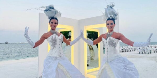 White party entertainers meeting and greeting guests.