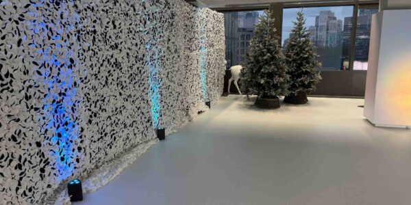 Elegant white Christmas draping and theming decorating the Fresha Office in London.