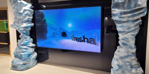 Bespoke Fresha branding displayed on LED television at corporate Christmas party.