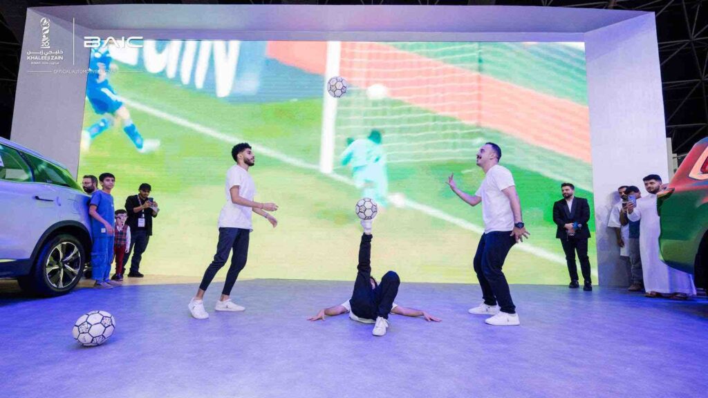 Three Football Freestylers performing at a corporate event