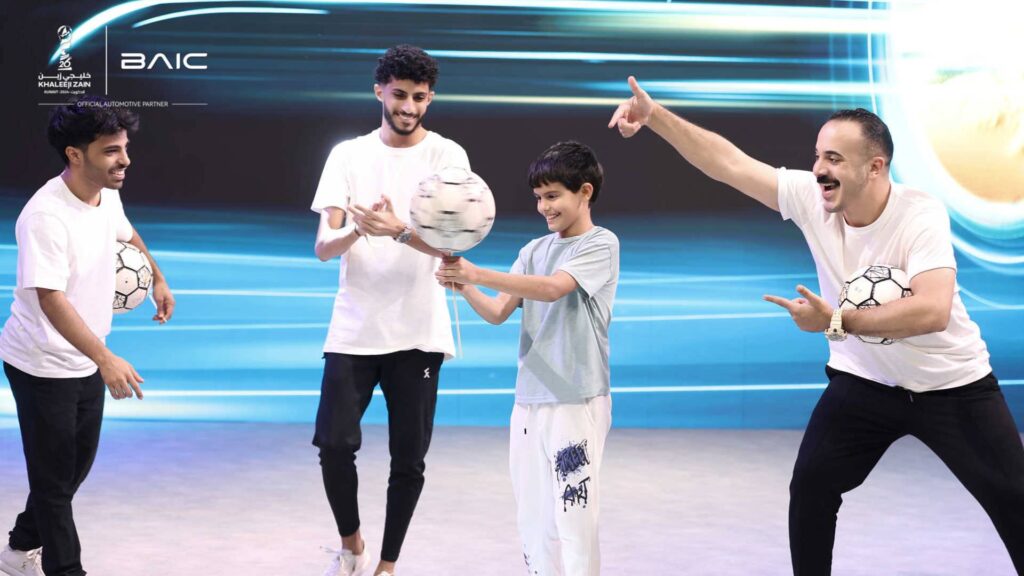 Jeddah Football Freestyle Team performing with audience member