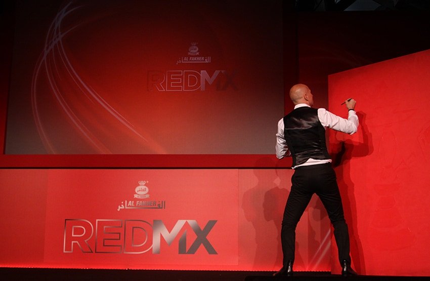 A speed artist performing at the Red Mix product launch