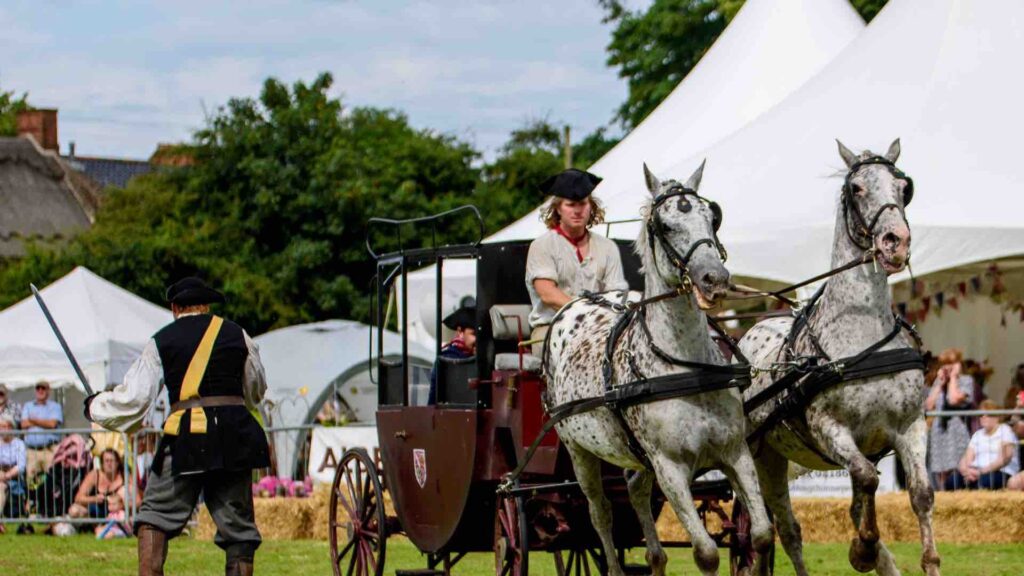 Performer being pulled by a horse