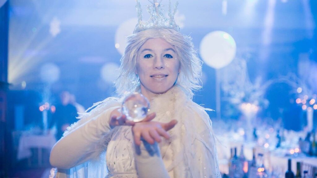 A Christmas contact juggler showing their skills at an event