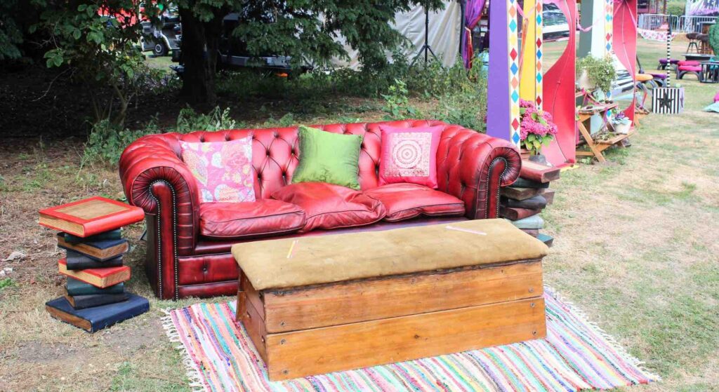 Red leather sofa used for outdoor mini-festival event.