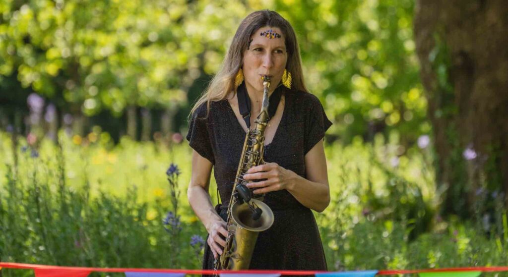 Roaming saxophonist player at a mini festival corporate event.