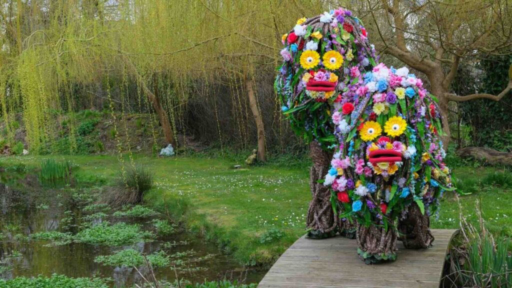 Quirky Flower Tree Puppets covered head to toe in greenery and florals
