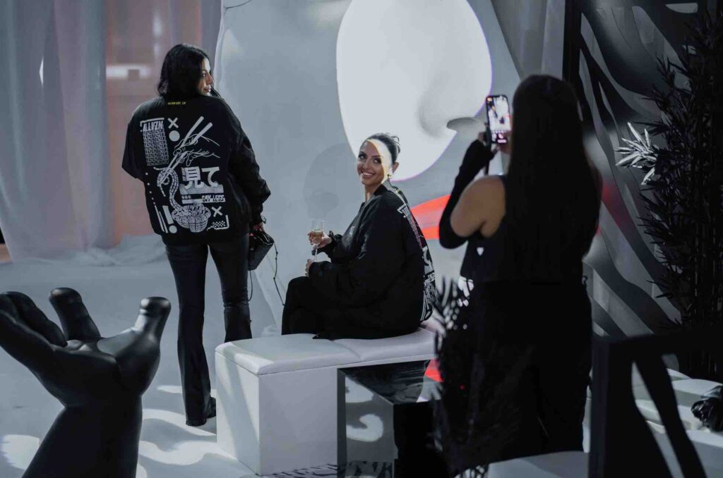 Guests posing at a photo area for an influencer Sidemen event