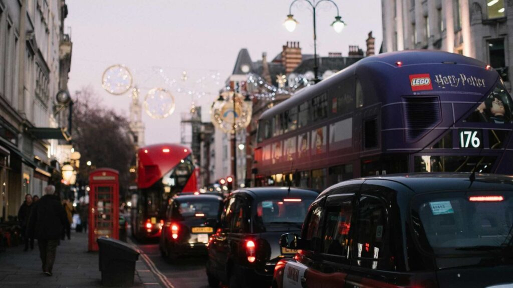 Pedestrians and traffic on Oxford Street, London.