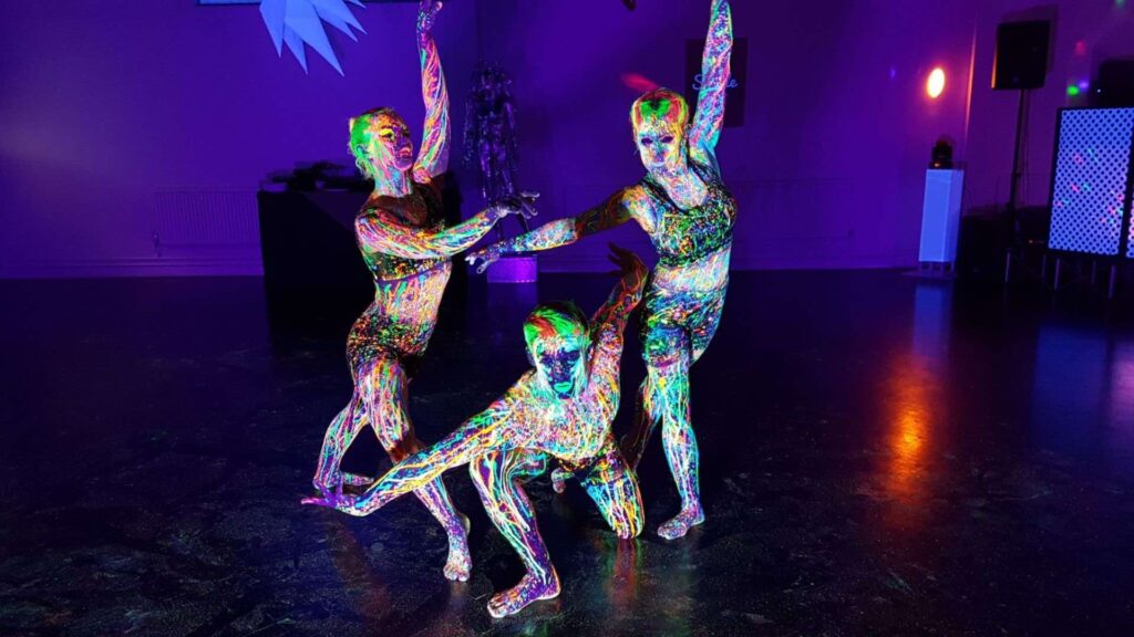 A UV performance group  posing