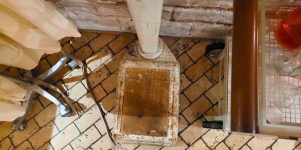A bird’s-eye view of the vintage weighing scales sets an eerie tone, emphasizing the cold, clinical atmosphere of the Asylum-themed event.