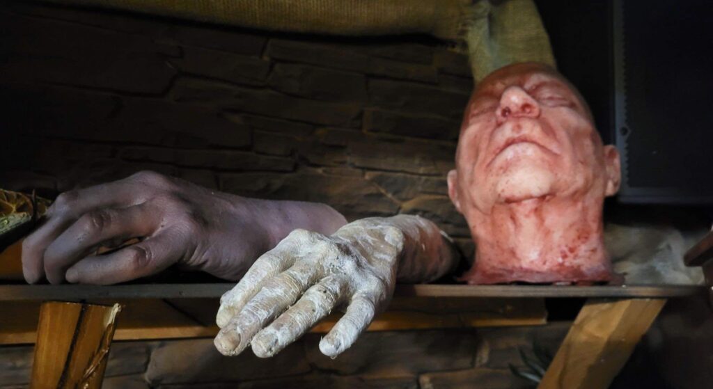 Creepy body part props used as Halloween event decor to elevate this Egyptian theme.