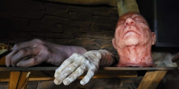 Creepy body part props used as Halloween event decor to elevate this Egyptian theme.