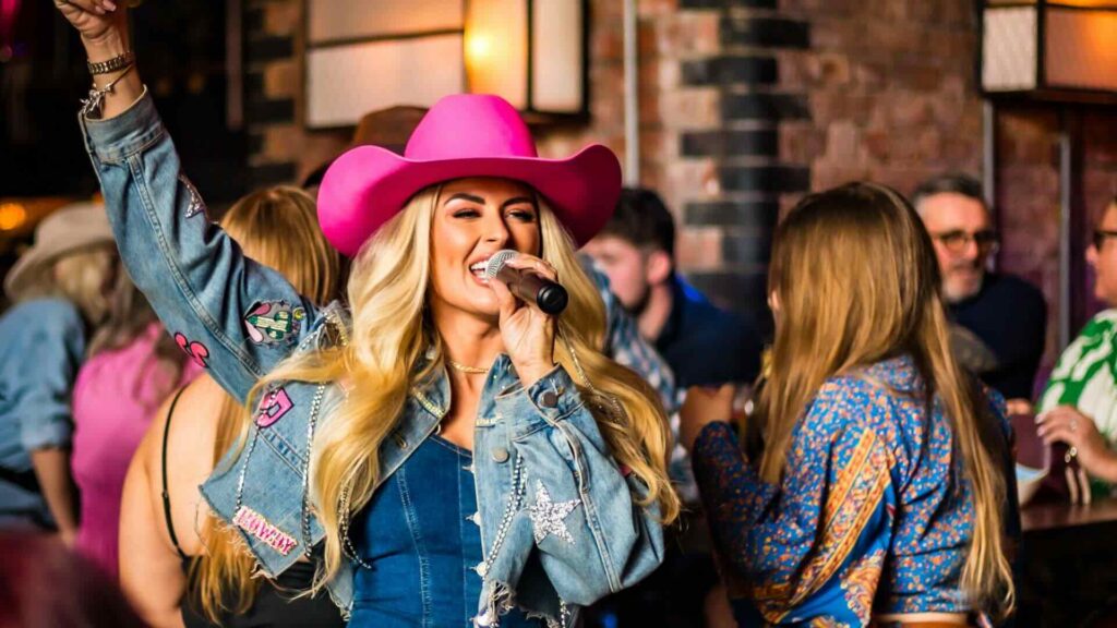 A cowboy performer with a microphone