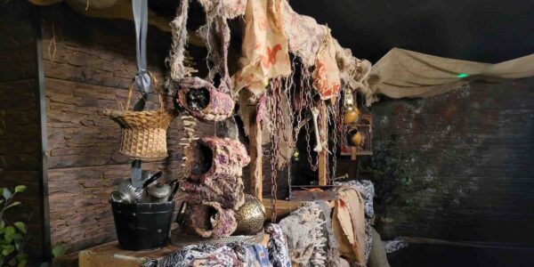 Egyptian themed market stall design with hanging textiles, props and relics, curated for a Halloween nightclub event.