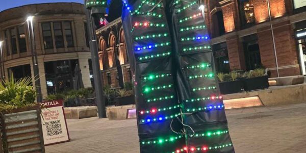 Glowing-Stiltwalking-Act