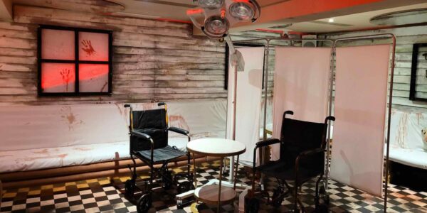 We used wheelchairs as seating for this haunted Hospital Asylum Halloween event theme.