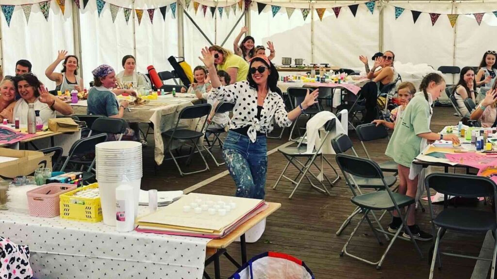A wellness workshop in an indoor tent.