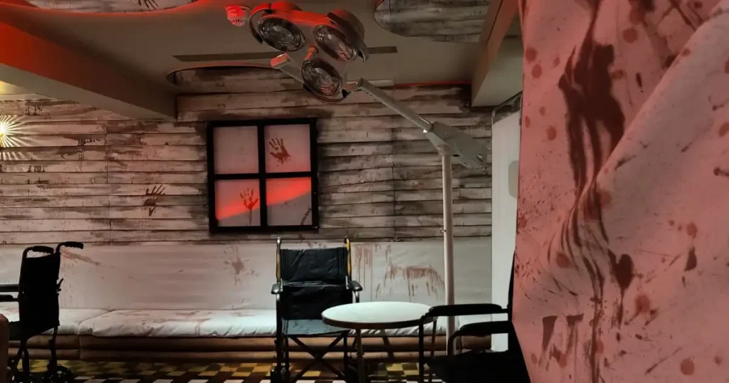 Wheel chairs and hospital operation light used for a Halloween set design to transform this nightclub seating area.