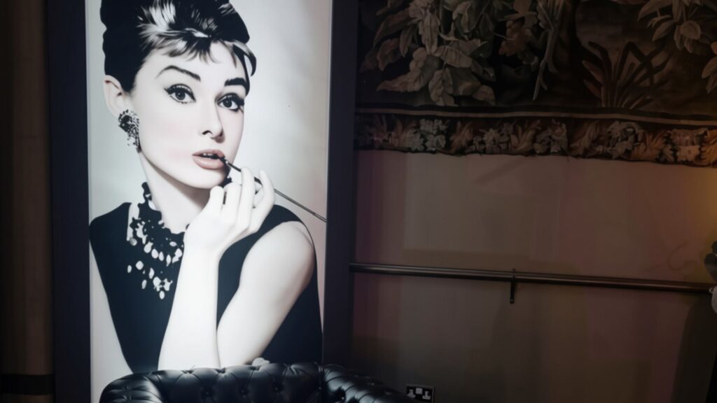 Illuminated black-and-white Hollywood portrait panel used as event décor