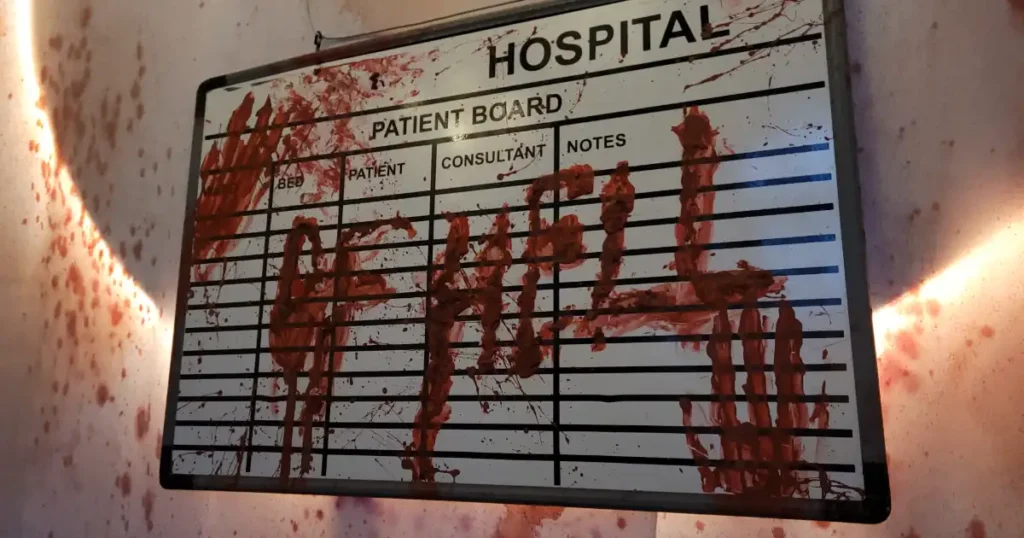 Blood smeared white board with hospital from hells crawled on it, used as part of Halloween venue styling for TABU nightclub. 