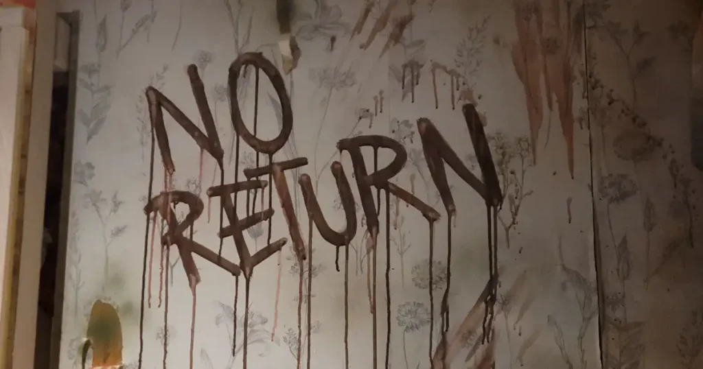 "NO RETURN" sign written in fake blood as part of a Halloween venue styling for an Asylum theme at London TABU. 