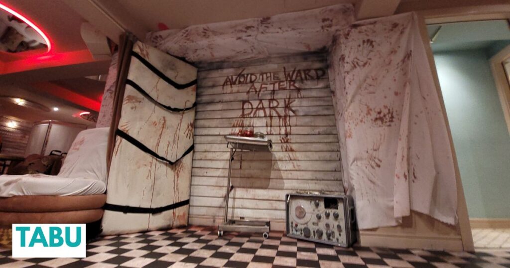 A haunting message scrawled on the wall 'avoid the ward after dark,' greets guests at this Asylum venue theming produced for TABU nightclub in London. 