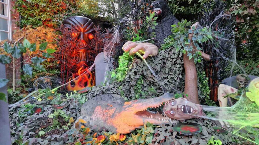 A family friendly themed area at a Halloween event, with crocodiles, spider webs and more