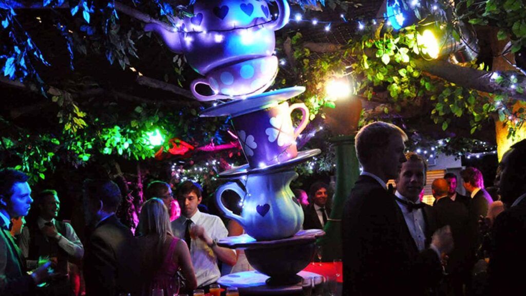 An Alice in Wonderland themed event with giant teacups and lighting