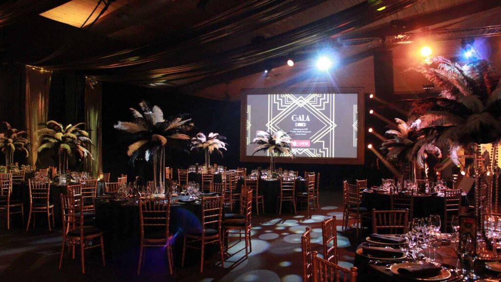 A 1920's Great Gatsby themed event with golds, blacks and bold decor.